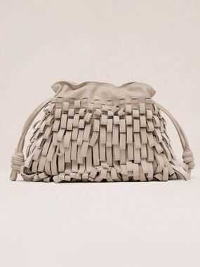 Alexis Quinn Fringe Woven Leather Drawstring Clutch in Vanilla